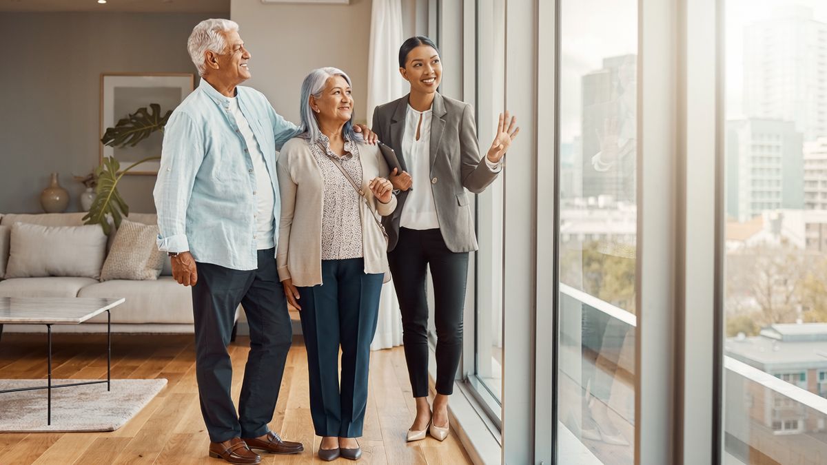 A couple touring an apartment with a real estate agent